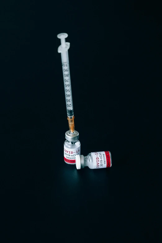 a syll with a needle sticking out of it, pexels, steroid use, round bottle, 2000s photo, iv pole