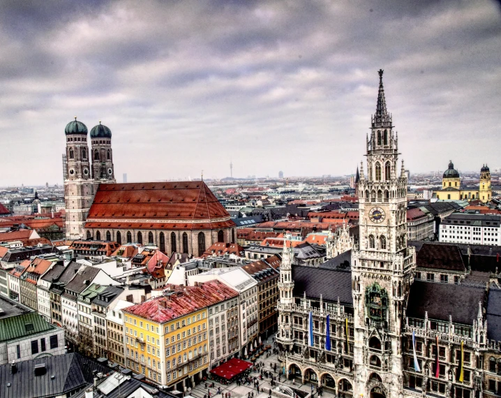 a view of a city from the top of a building, by Kristian Zahrtmann, pexels contest winner, art nouveau, munich, cathedral in the background, square, 2000s photo