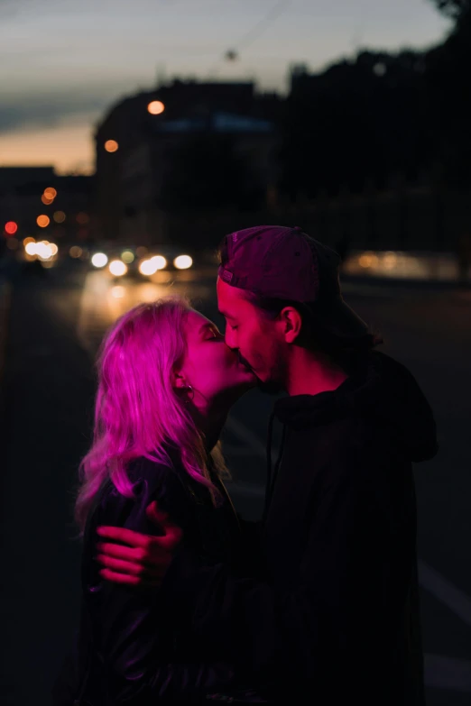 a man and woman standing next to each other on a street, pexels contest winner, romanticism, lesbian kiss, purple glow, 15081959 21121991 01012000 4k, a blond