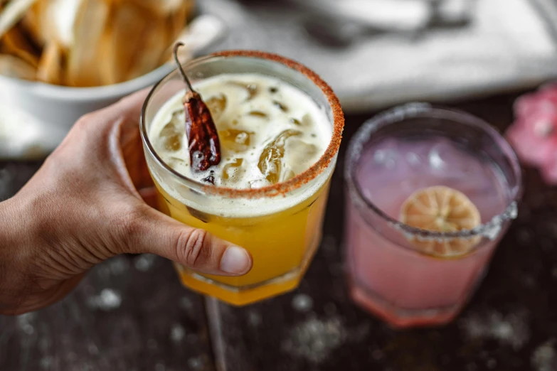 a close up of a person holding a drink, spicy, blanca alvarez, far view, food