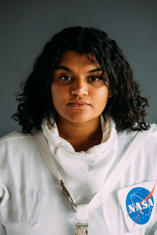 a woman in a space suit posing for a picture, by Alison Geissler, imaan hammam, headshot profile picture, ash thorp khyzyl saleem, promo image