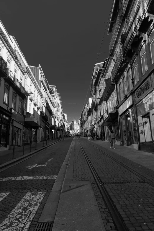 a black and white photo of a city street, a black and white photo, by Altichiero, calm evening, 2 2 nd century!!!!! town street, gui guimaraes, liege
