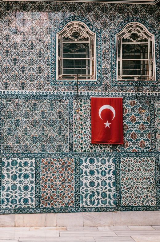 a red fire hydrant sitting in front of a building, a mosaic, inspired by Osman Hamdi Bey, trending on pexels, flag, 256x256, turkey, teal white gold color palette