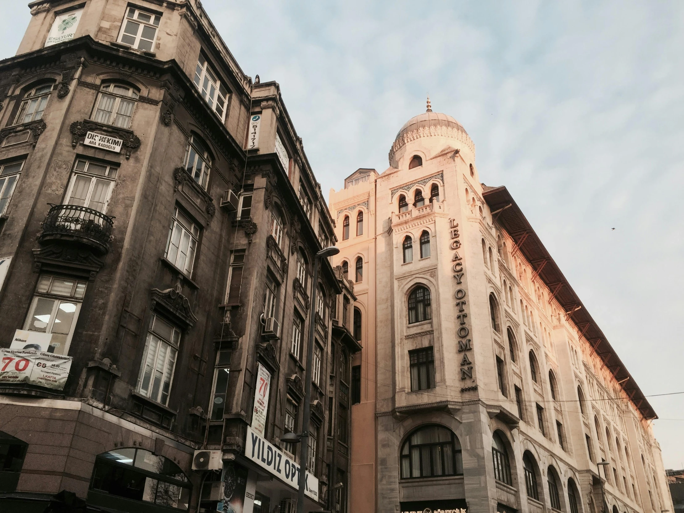 a couple of buildings that are next to each other, a photo, pexels contest winner, art nouveau, ottoman empire, 90's photo, fan favorite, high quality upload