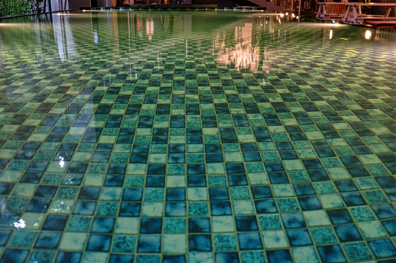 a pool filled with lots of green tiles, inspired by Henri Le Sidaner, unsplash, checkerboard pattern underwater, teal lights, swimming in a pool of coffee, square lines