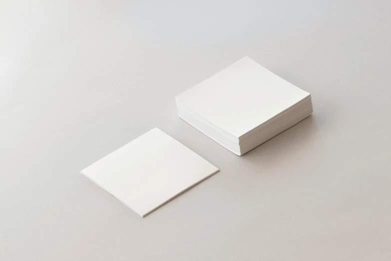 a stack of white cards sitting on top of a table, an album cover, by Shigeru Aoki, double layer fold over hem, thumbnail, square, no - text no - logo