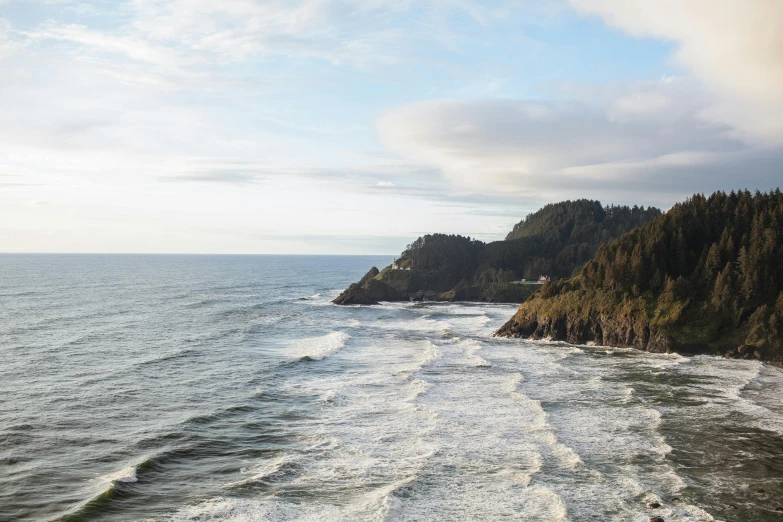 a view of the ocean from the top of a hill, by Jessie Algie, unsplash contest winner, renaissance, oregon, towering waves, trees and cliffs, thumbnail