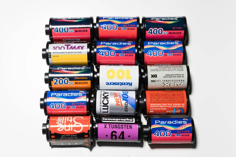 a group of batteries sitting on top of each other, by Joe Bowler, medium - format print, movies, technicolor film, daido moriyama