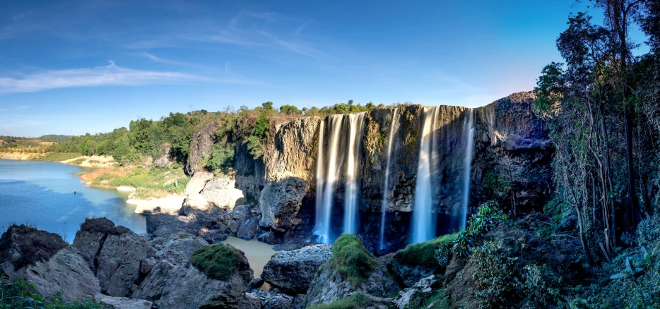 a waterfall in the middle of a large body of water, madagascar, avatar image