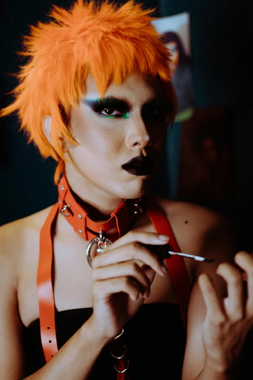 a woman with orange hair holding a pair of scissors, inspired by Nan Goldin, trending on pexels, transgressive art, colorful rave makeup, spiked collar, smoking, he is a long boi ”