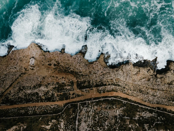 a view of the ocean from a bird's eye view, pexels contest winner, erosion, thumbnail, landslides, wall of water either side