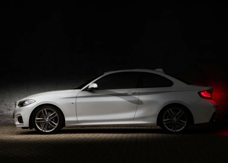 a white bmw car parked in the dark, a picture, by Thomas Häfner, minimalism, modern minimalist f 2 0, side - view, 2015, fan favorite
