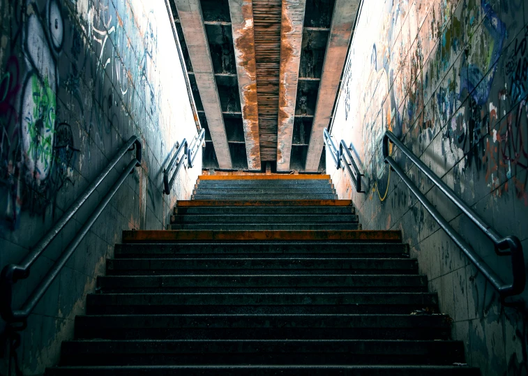 a set of stairs with graffiti on the walls, unsplash contest winner, looking from slightly below, it's getting dark, infrastructure, instagram post