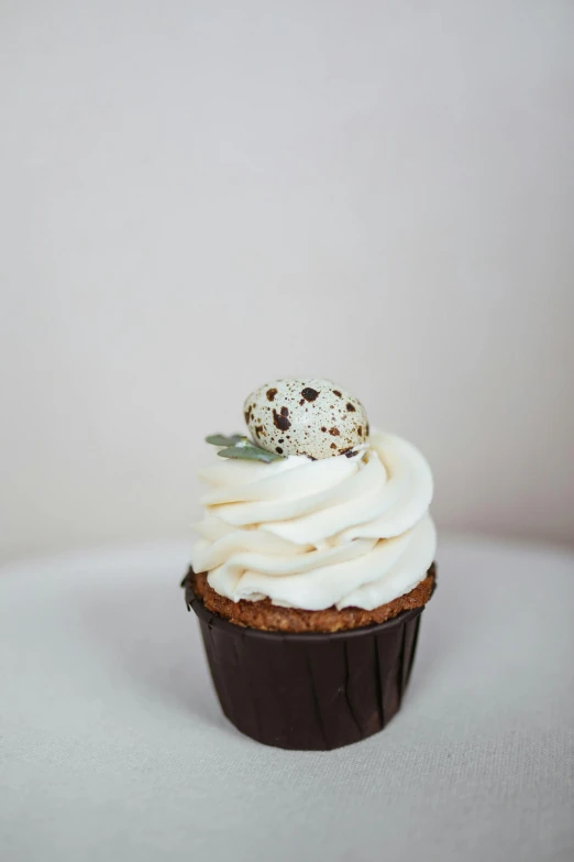 a cupcake sitting on top of a white table, savory, f / 2 0, high grain, curated collections