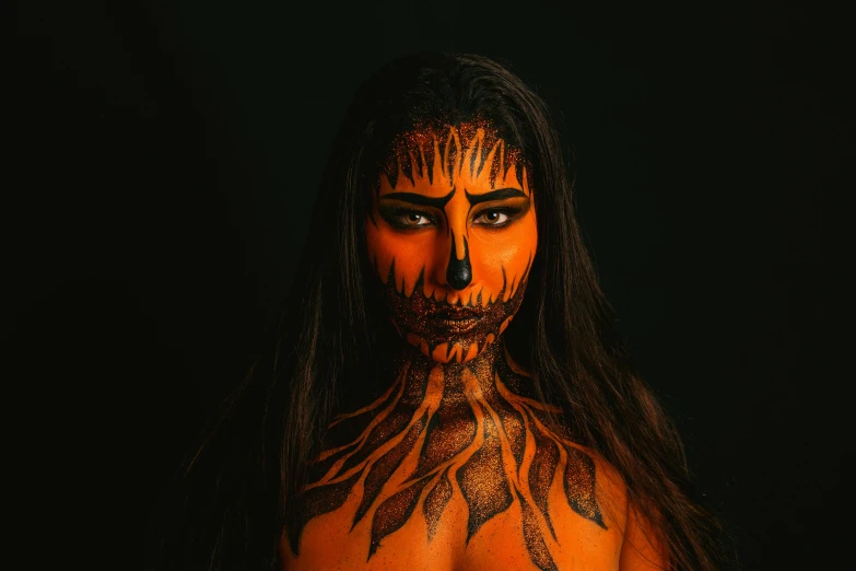 a close up of a person with a painted face, dark orange, full - body art, furious dark haired women, fall season