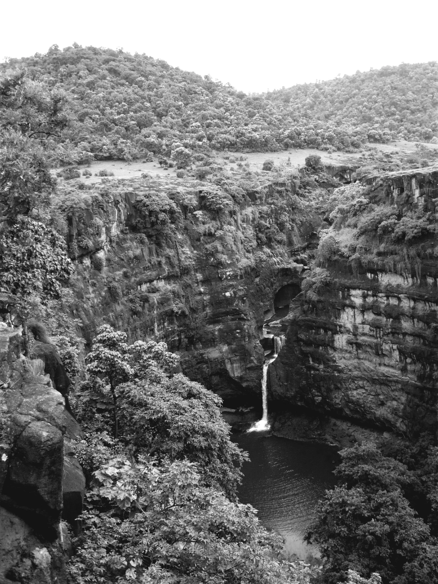 a black and white photo of a waterfall, by Maurycy Gottlieb, brazil, 2 5 6 x 2 5 6 pixels, top of a canyon, ( ( ( ( kauai ) ) ) )