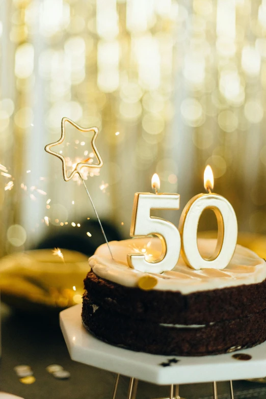 a birthday cake sitting on top of a table, shutterstock, figuration libre, 50 years old, shooting star in background, bokeh ”, thumbnail