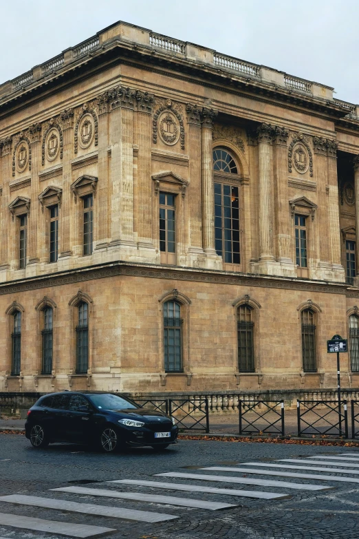 a car is parked in front of a large building, pexels contest winner, paris school, neoclassical style, lots de details, street elevation, musee d'orsay 8 k