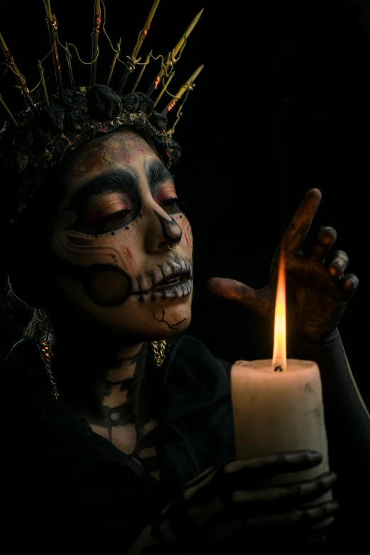 a woman with makeup holding a lit candle, by Alejandro Obregón, pexels contest winner, vanitas, aztec god, prosthetic makeup, kris kuksi, fuming effigy