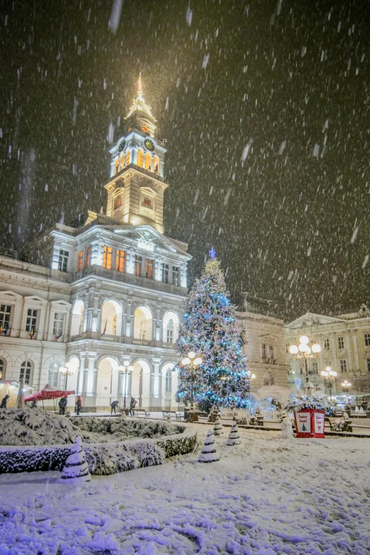 a large building with a christmas tree in front of it, by Brian Thomas, unsplash contest winner, baroque, city snowing with a lot of snow, chile, town hall, hull