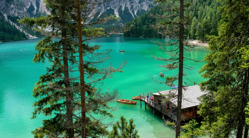 a dock in the middle of a lake surrounded by trees, by Sebastian Spreng, pexels contest winner, hurufiyya, turquoise water, gondolas, lago di sorapis, thumbnail