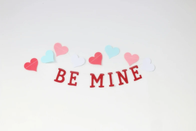 a sign that says be mine surrounded by hearts, trending on unsplash, set against a white background, red banners, papercraft, demur