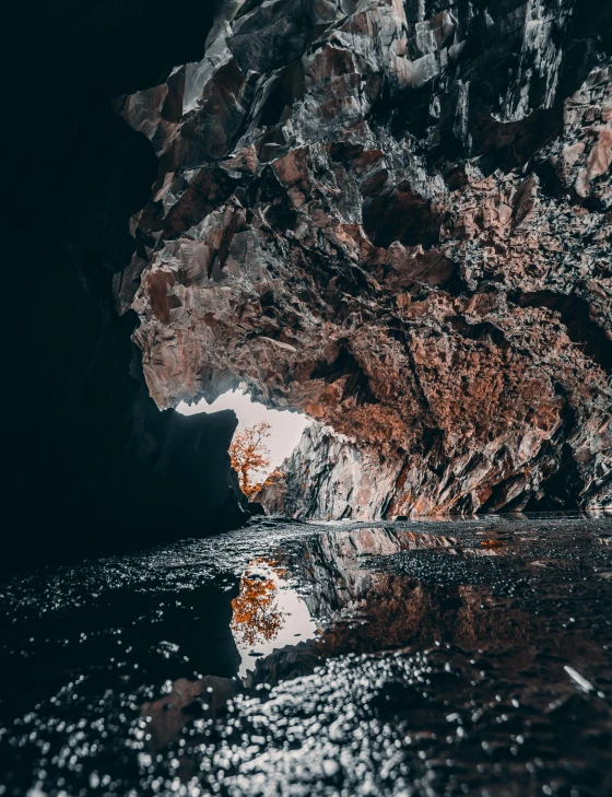 a large rock in the middle of a body of water, in a cave, iceland photography, thumbnail, instagram story