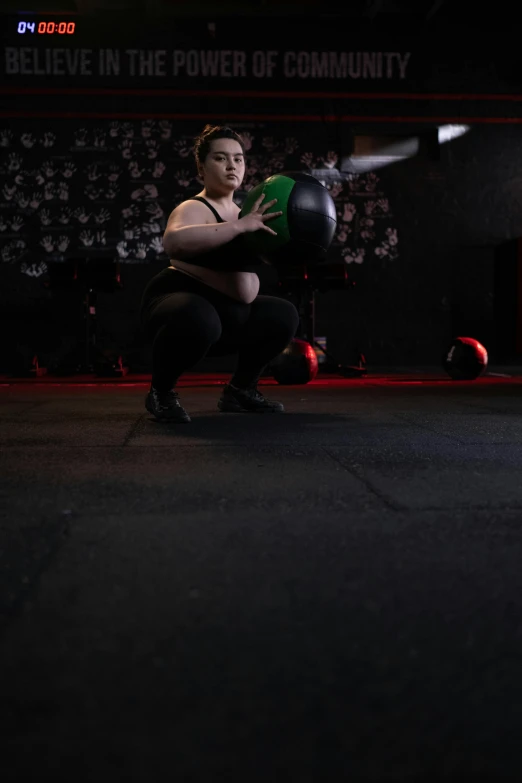 a woman squatting in the middle of a boxing ring, by Robbie Trevino, a woman holding an orb, lifting weights, profile image, andy milonakis