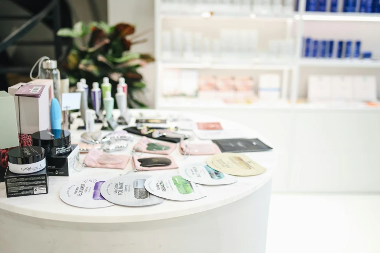 a table with a lot of beauty products on it, private press, inside white room, product display, analogue, display item