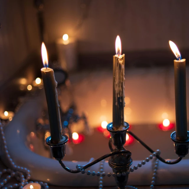 a bath tub filled with candles on top of it, inspired by Elsa Bleda, shutterstock, baroque, gothic lighting, grey, christmas night, instagram photo