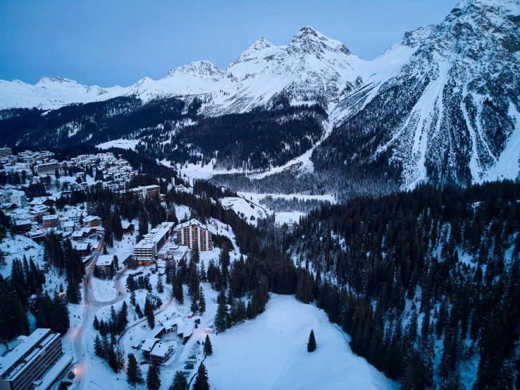 an aerial view of a ski resort in the mountains, pexels contest winner, renaissance, blue hour, mario testino, grey, lush surroundings