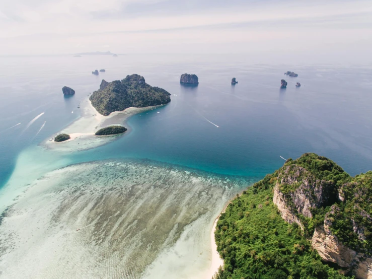 an island in the middle of a body of water, by Rachel Reckitt, pexels contest winner, thai, view from helicopter, thumbnail, archipelago