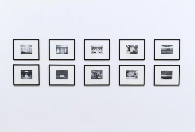 a group of black and white photographs hanging on a wall, a black and white photo, pexels, visual art, with a white background, artwork, animation, compressed jpeg
