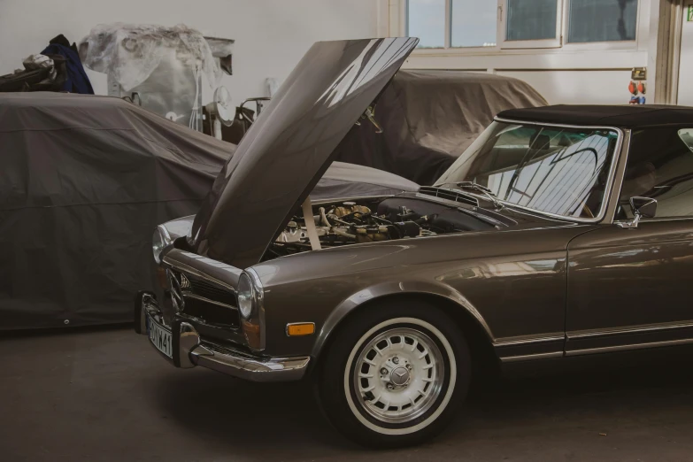 a brown car is parked in a garage, by Daniel Lieske, pexels contest winner, ultra realistic classic, soft top, engine, vintage - w 1 0 2 4