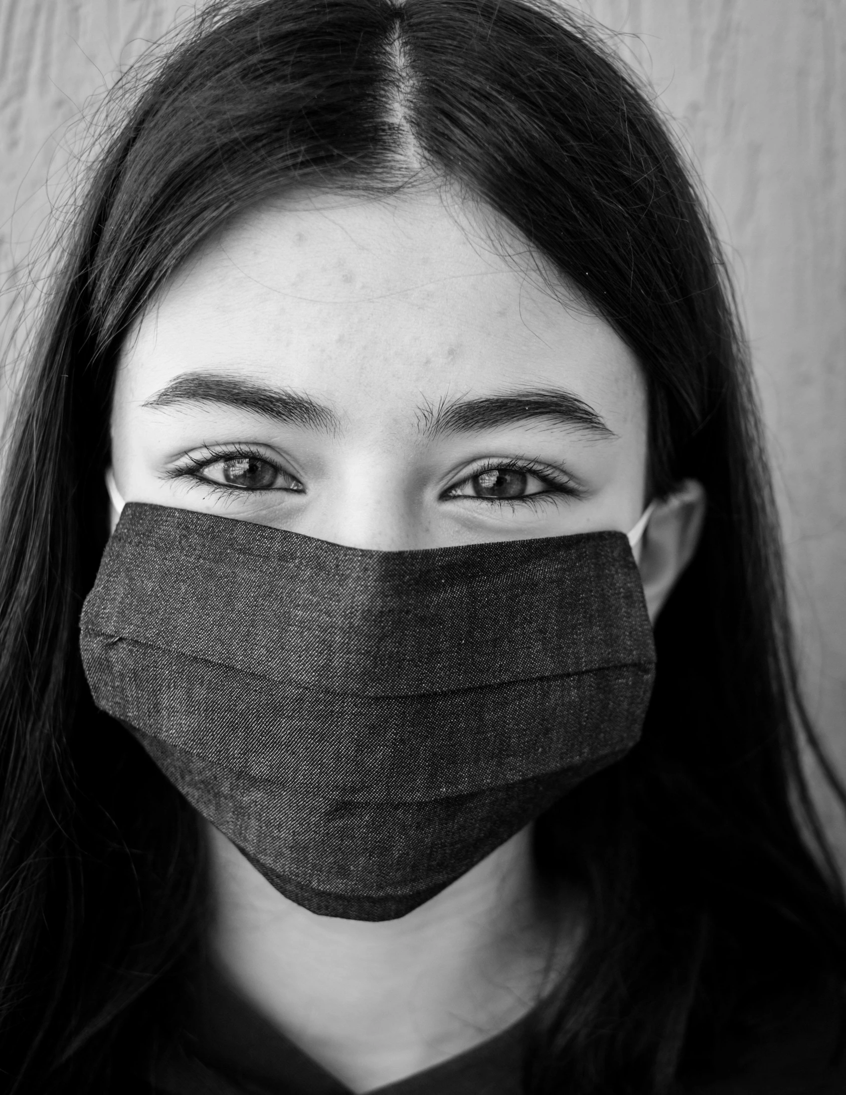 a black and white photo of a woman wearing a face mask, pexels contest winner, girl with white eyes, teenage girl, asian human, healthcare