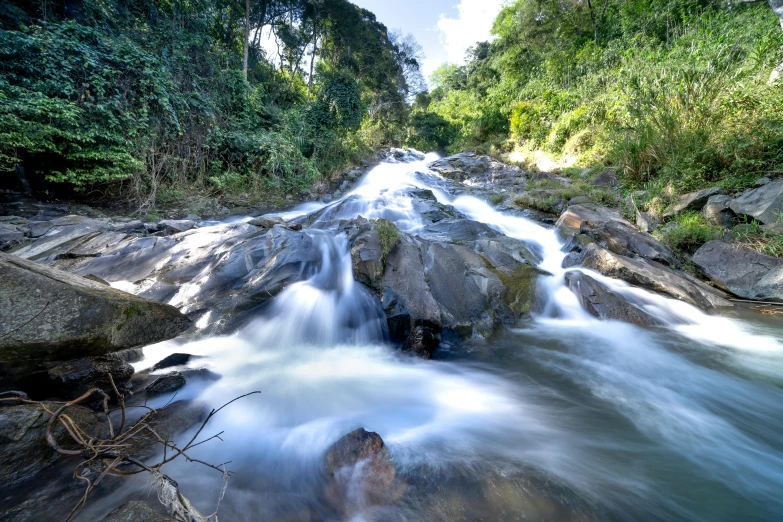 a river running through a lush green forest, hurufiyya, water splashing cascading, profile image, malaysian, thumbnail
