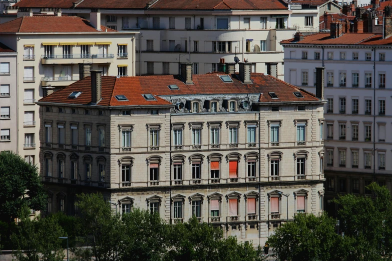 a group of buildings that are next to each other, by Cricorps Grégoire, pexels contest winner, art nouveau, orange roof, split near the left, le corbeusier, exterior view