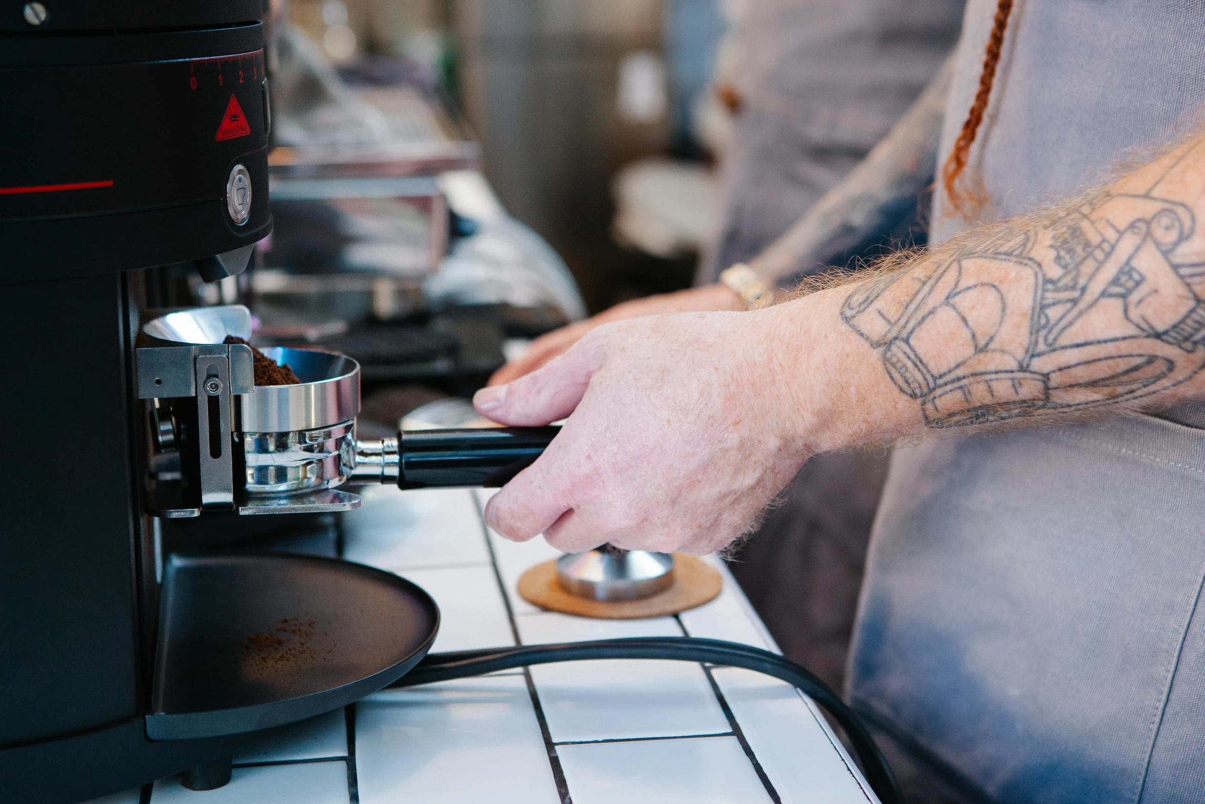 a close up of a person using a coffee machine, by Nick Fudge, holding magical kitchen knives, leaking pistons, jamie coreth, “ iron bark