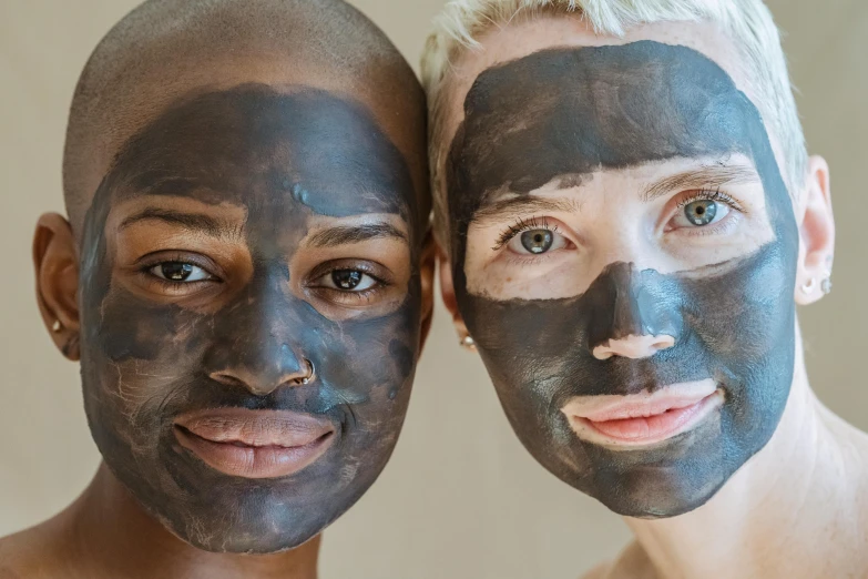 two men with facial masks on their faces, trending on pexels, black scars on her face, androgynous face, brown mud, charcoal and champagne