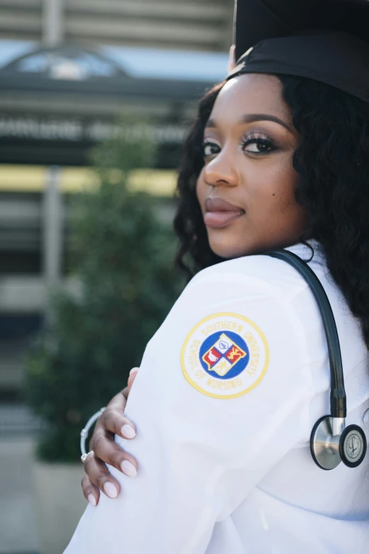 a woman in a graduation gown with a stethoscope, a portrait, inspired by Dr. Atl, trending on unsplash, doja cat, in uniform, overlooking, wearing a white gi