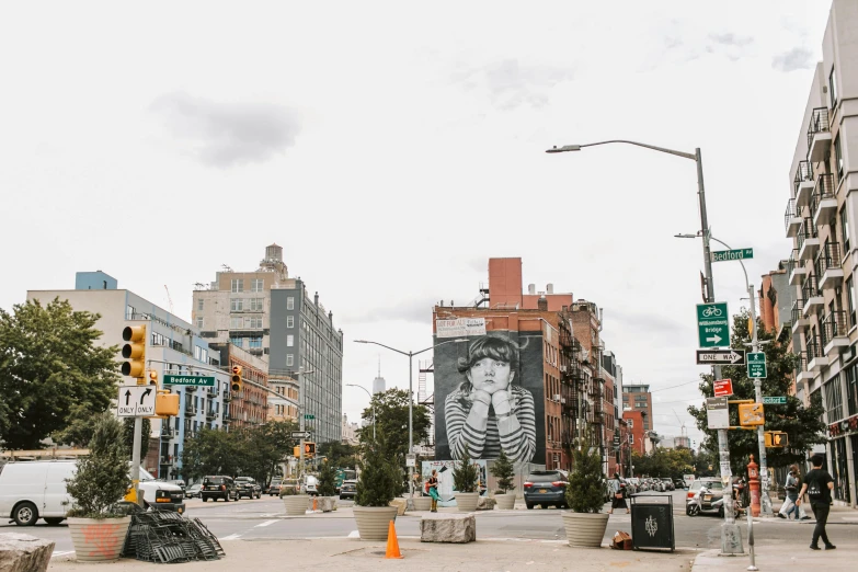 a street filled with lots of traffic next to tall buildings, a picture, visual art, brooklyn, billboard image