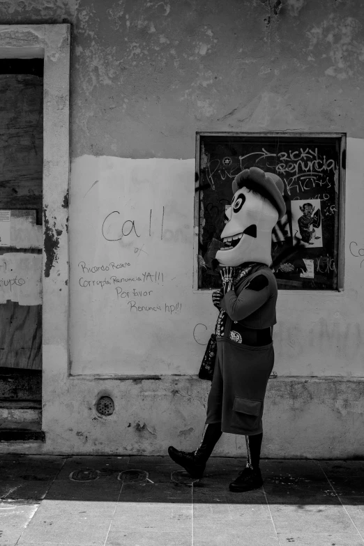 a person that is standing in front of a building, a black and white photo, by Altichiero, pexels contest winner, graffiti, anthropomorphic otter in costume, military police, tlaquepaque, claymation character