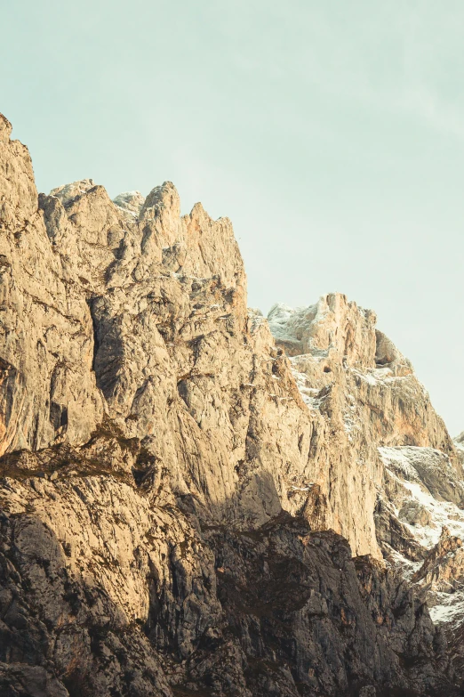 a group of people standing on top of a mountain, poster art, by Matthias Weischer, trending on unsplash, minimalism, extremely detailed rocky crag, italy, soft golden light, panoramic