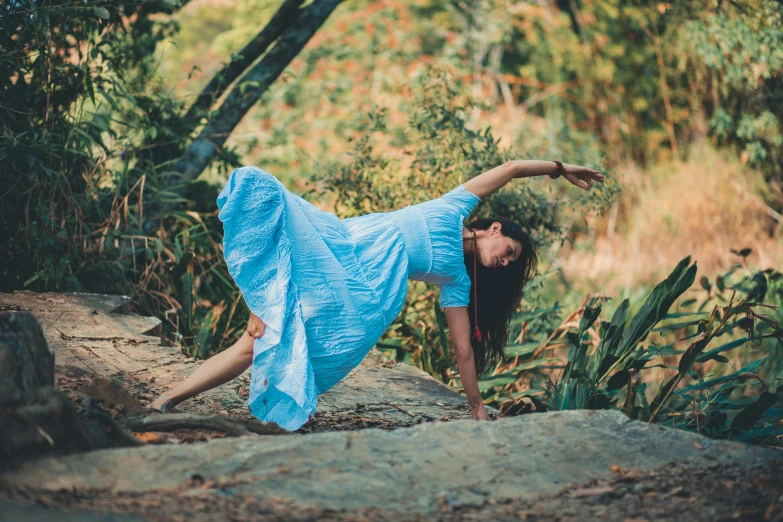 a woman in a blue dress doing a yoga pose, unsplash, arabesque, amidst nature, female dancer, 15081959 21121991 01012000 4k, avatar image