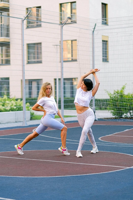 a couple of women standing on top of a basketball court, pexels contest winner, arabesque, transhumanist dancing, maria panfilova, square, 15081959 21121991 01012000 4k
