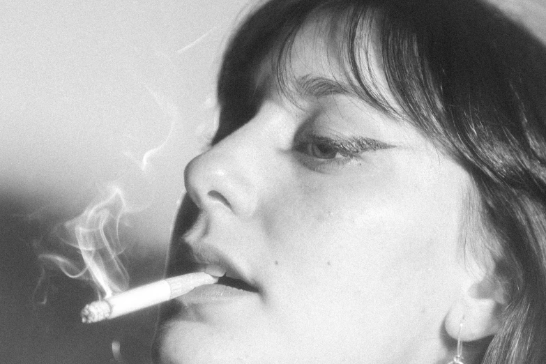 a black and white photo of a woman smoking a cigarette, by Sergio Burzi, flickr, hyperrealism, amelie poulain, mark e smith, teenage girl, perfect blue