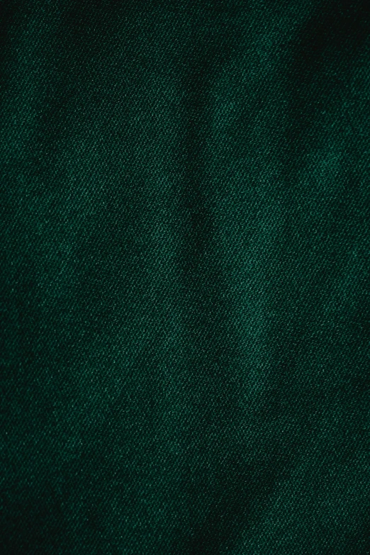 a close up of a dark green fabric, teal gradient, or black, green corduroy pants, ((greenish blue tones))