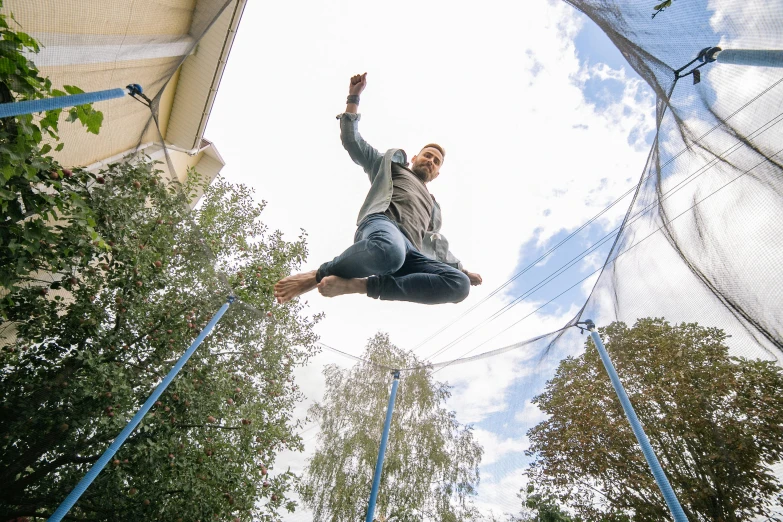 a man jumping in the air on a trampol, pexels contest winner, avatar image, 15081959 21121991 01012000 4k, swedish, at home