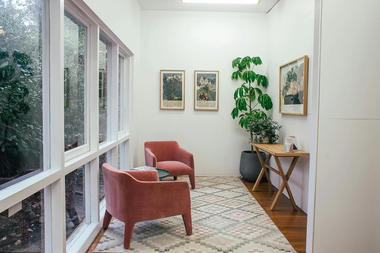 a living room filled with furniture next to a window, by Liza Donnelly, unsplash, light and space, doctors office, botanic foliage, comfy chairs, gallery display photograph