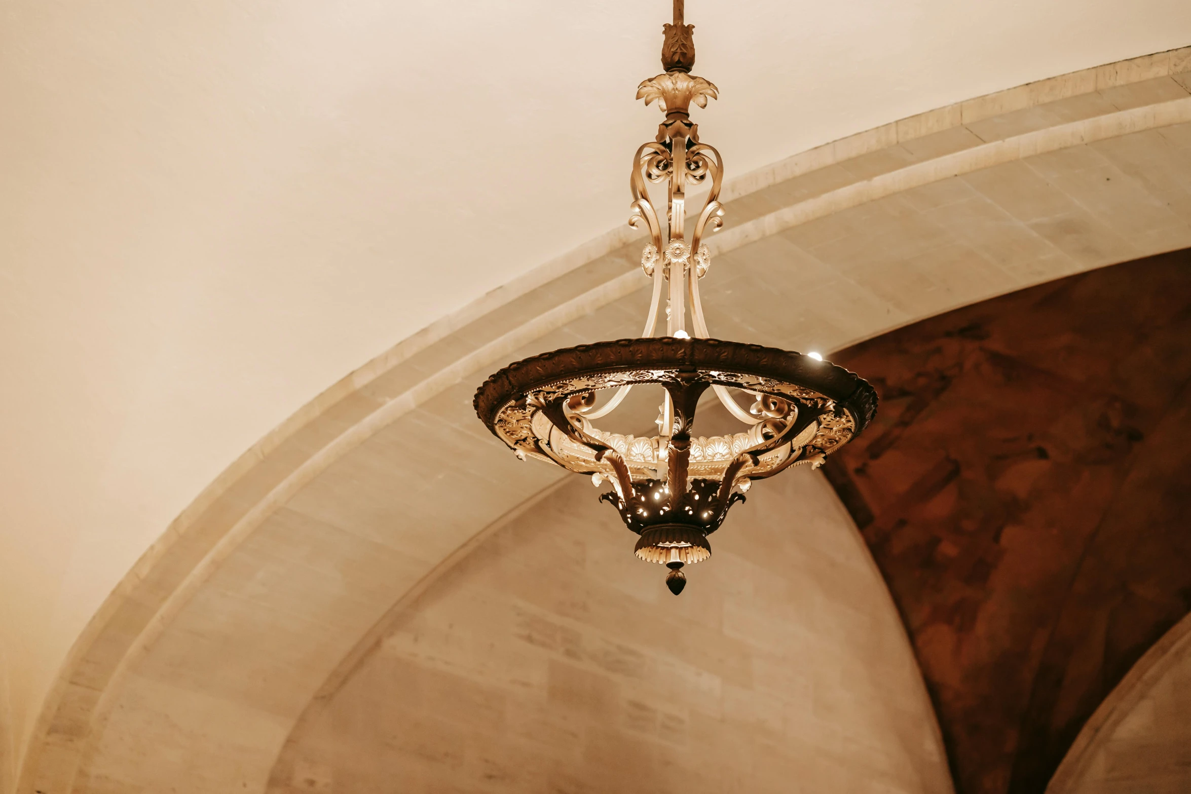 a chandelier hanging from the ceiling of a building, trending on pexels, baroque, an archway, golden dappled lighting, cafe lighting, dramatic entry